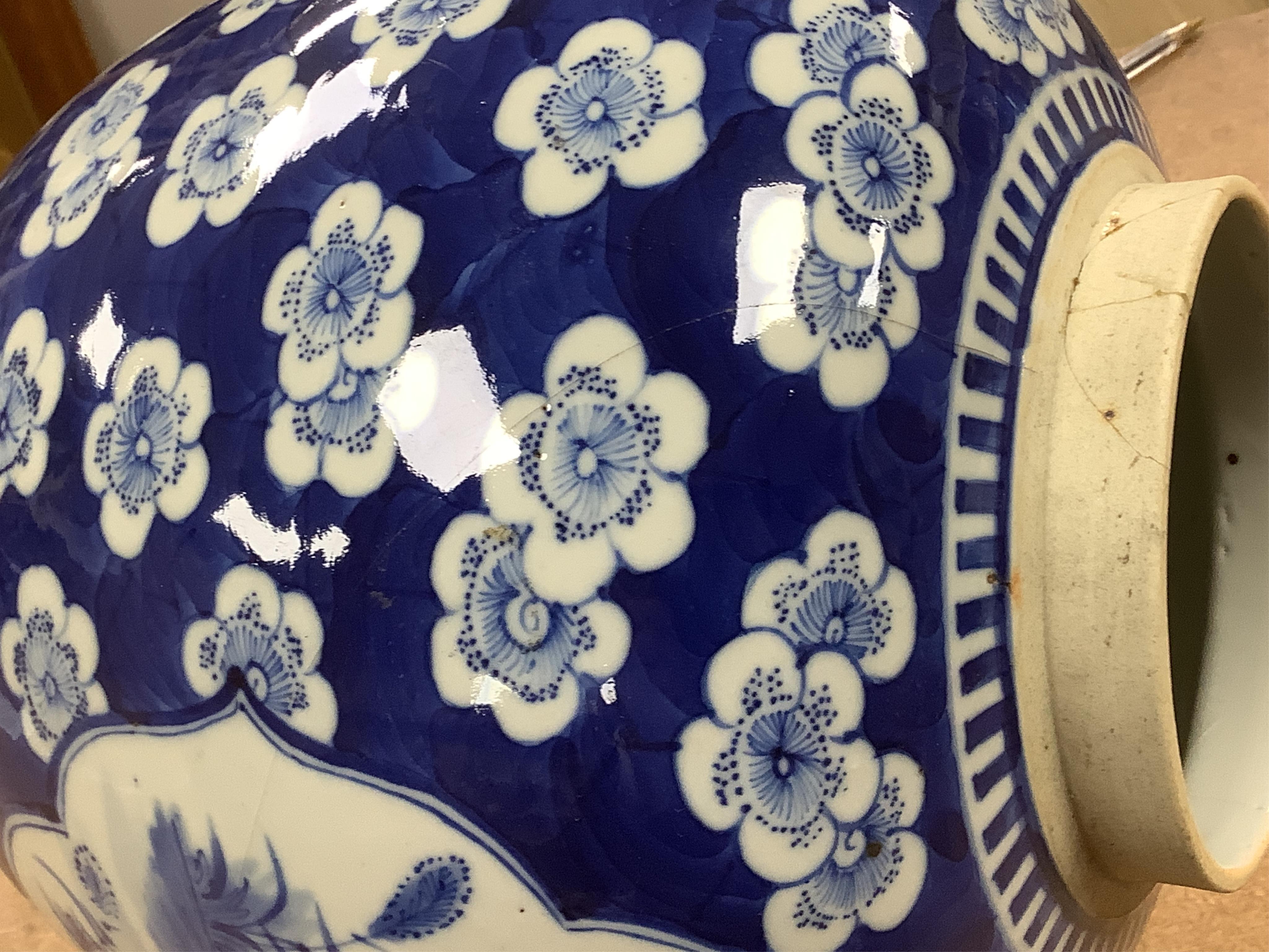 A 19th century Chinese blue and white jar and cover, on hardwood stand, 34cm high